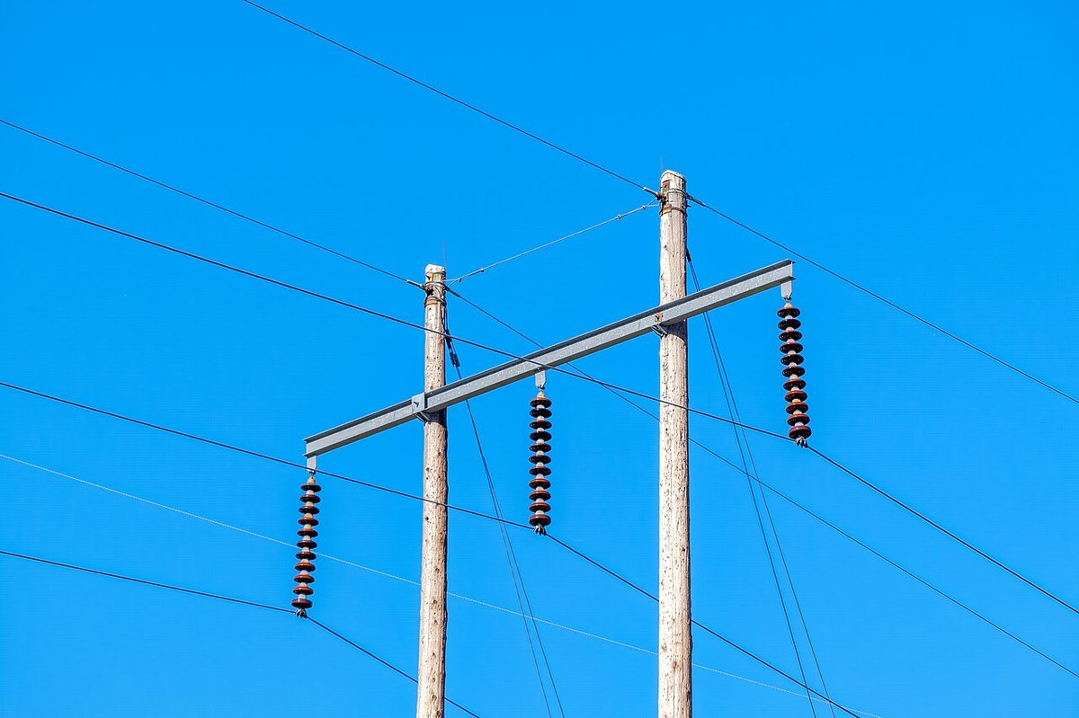 Wood poles with a steel crossarm and suspension insulators