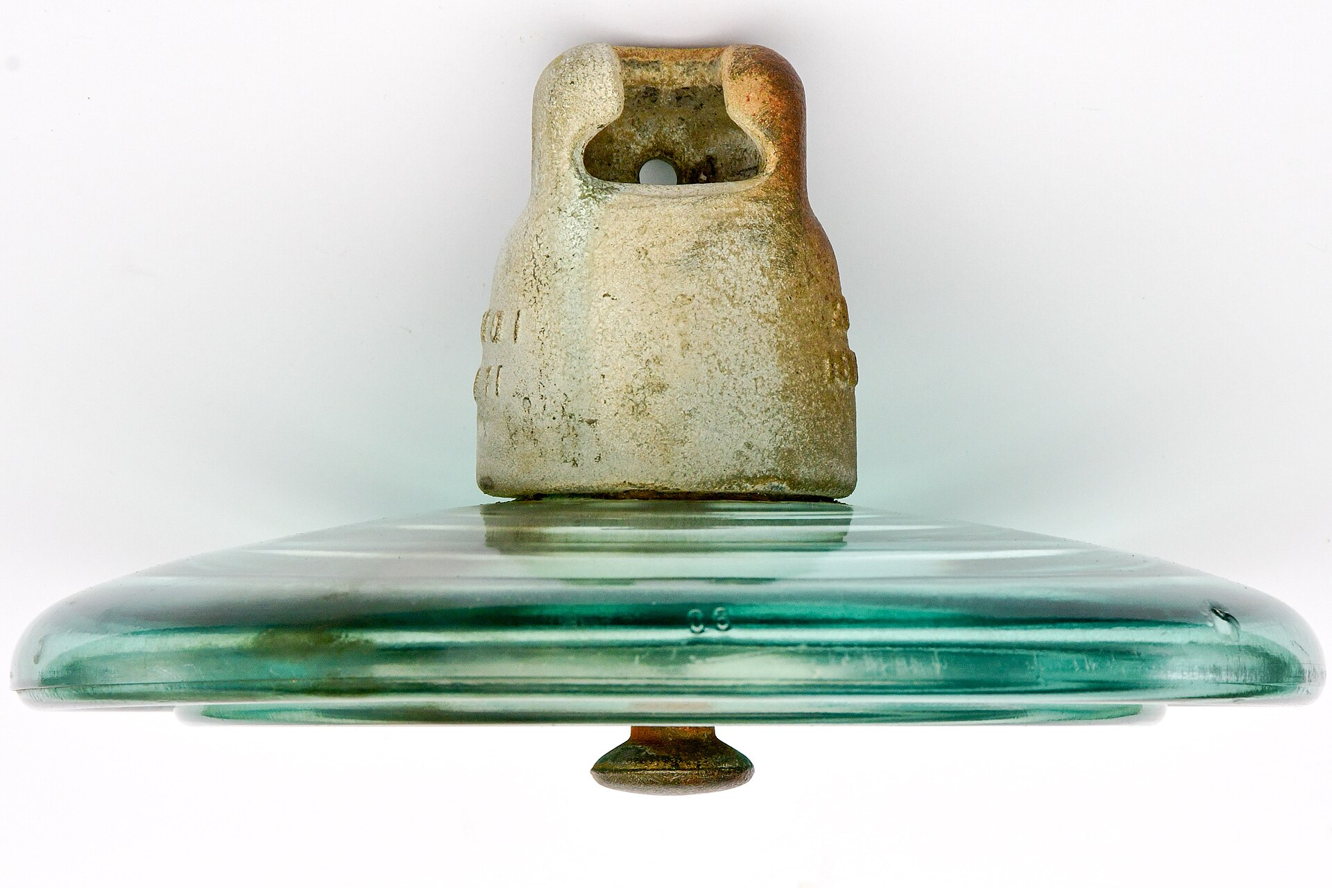 Toughened glass disc insulator showing cap, pin and glass shell