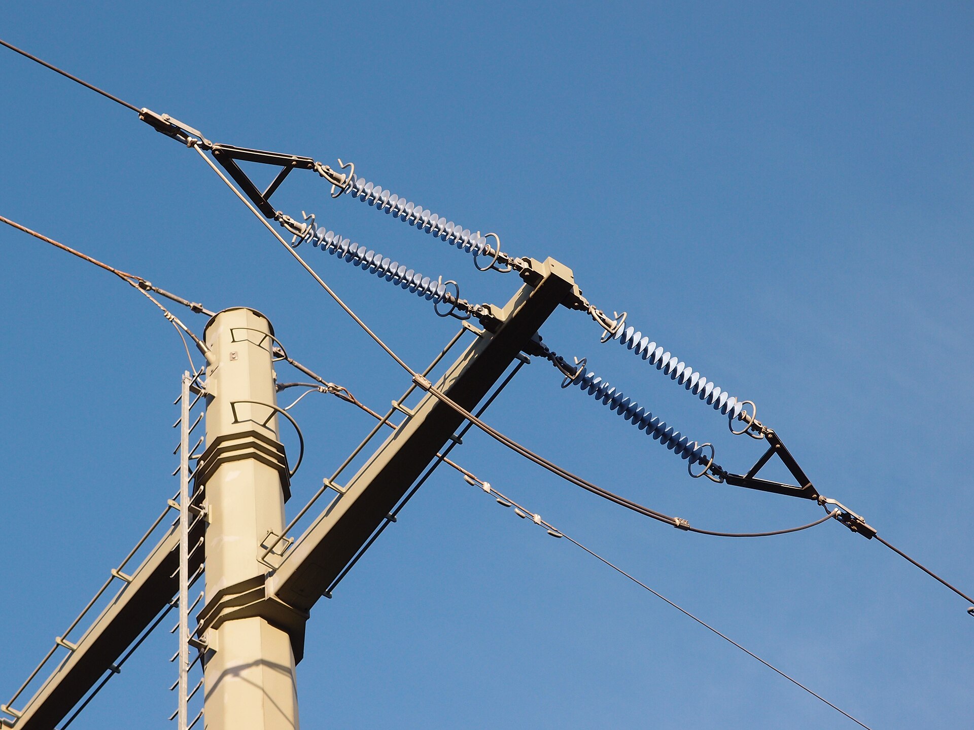 Grey silicone rubber composite long rod insulators on a 110 kV steel pole