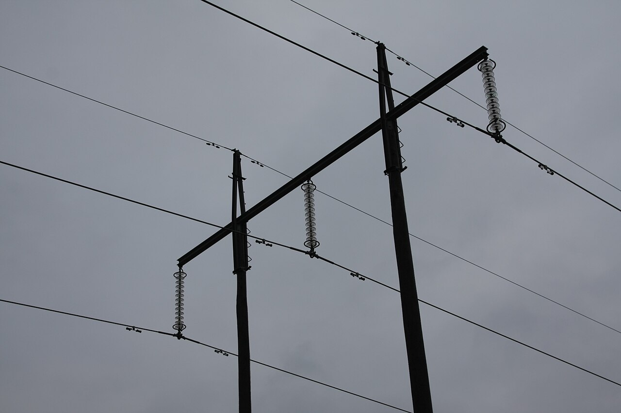 Legacy disc insulator strings hanging from a lattice transmission structure