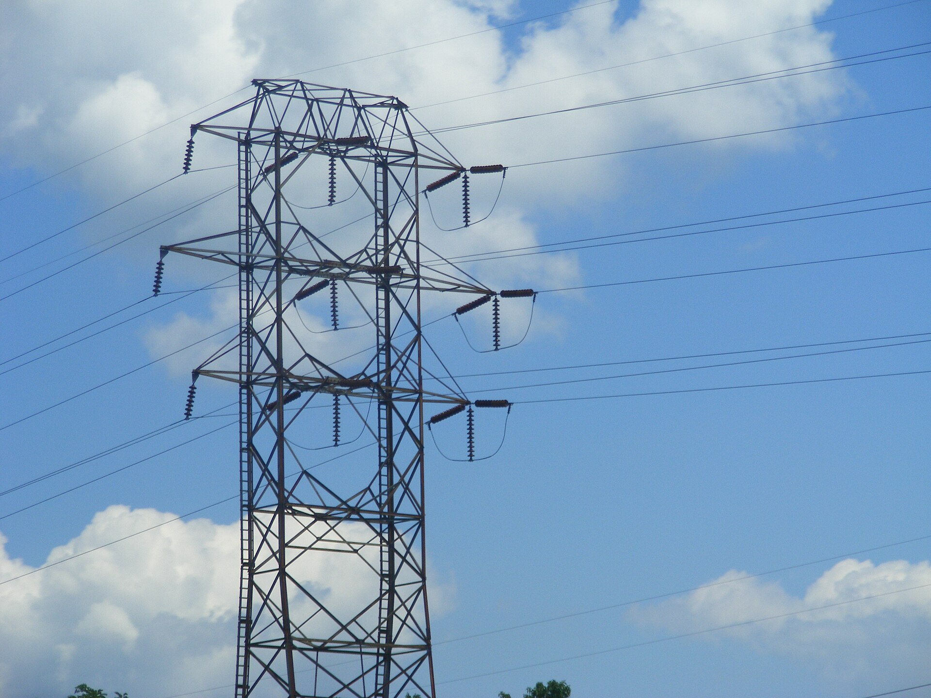 Suspension insulator strings on a lattice transmission tower
