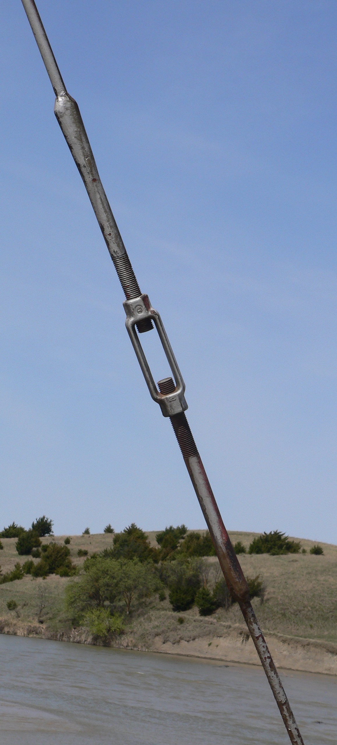 Open-body turnbuckle under tension on a stay rod