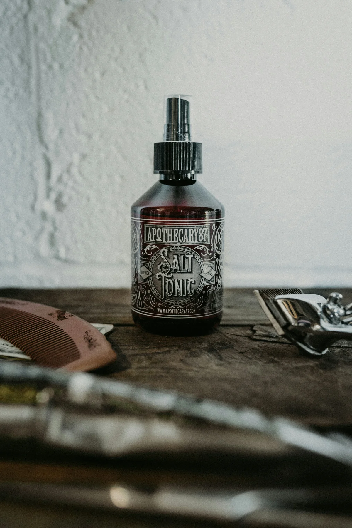 Hyper-realistic product photography, a composite insulator exposed to harsh coastal environment with salt spray, water droplets rolling off the hydrophobic silicone surface, demonstrating self-cleaning properties, high-definition detail, no text, no brand logo