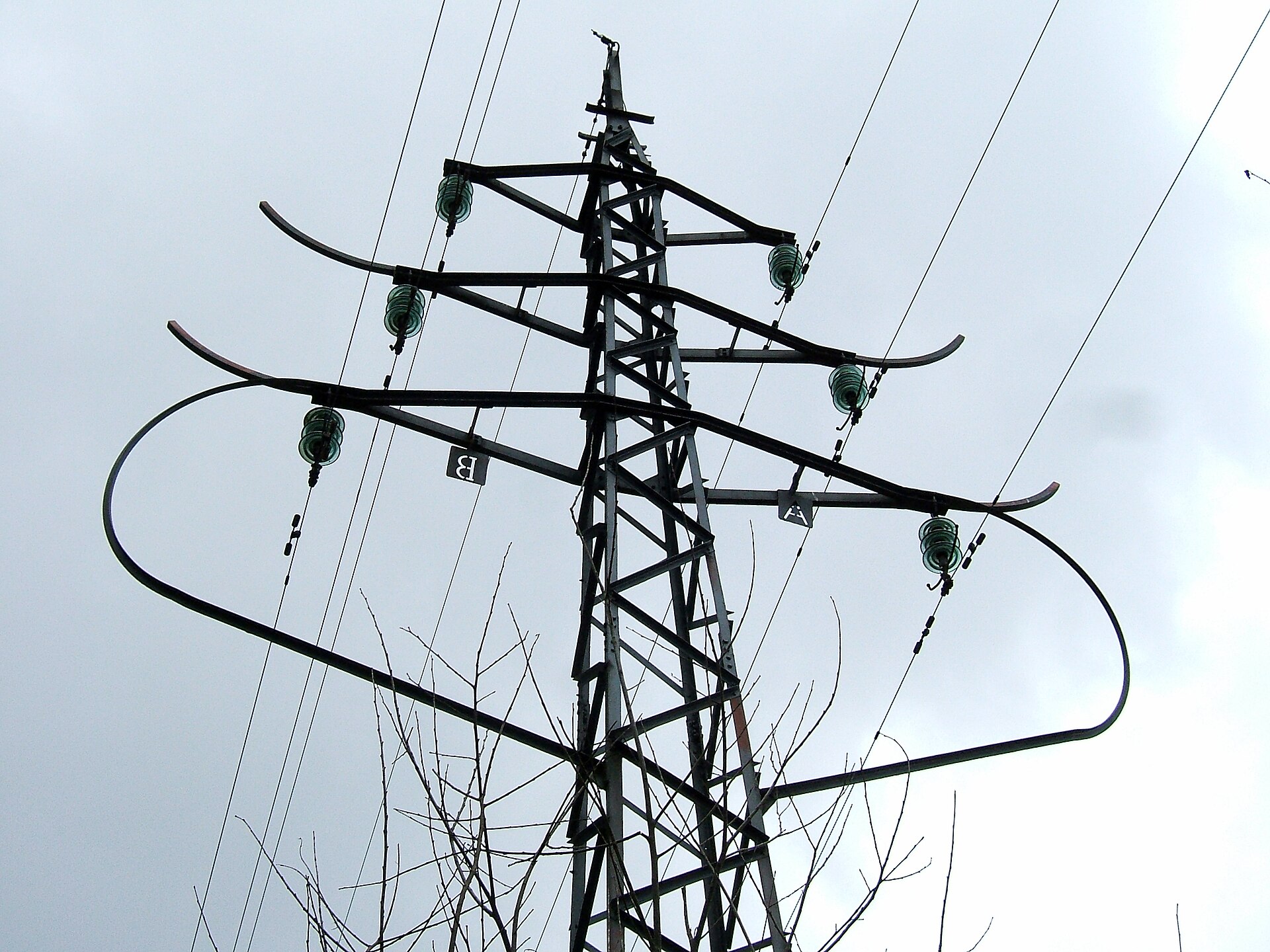 Disc insulator strings hanging from a steel suspension pylon