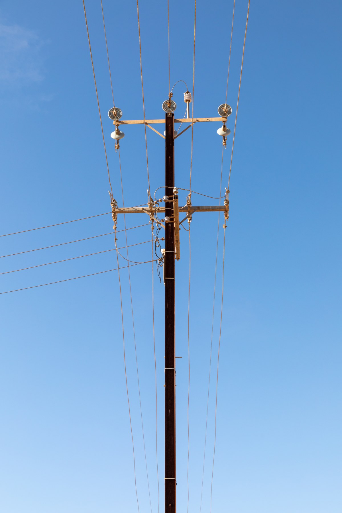 Pole top crossarm fitted with line post insulators