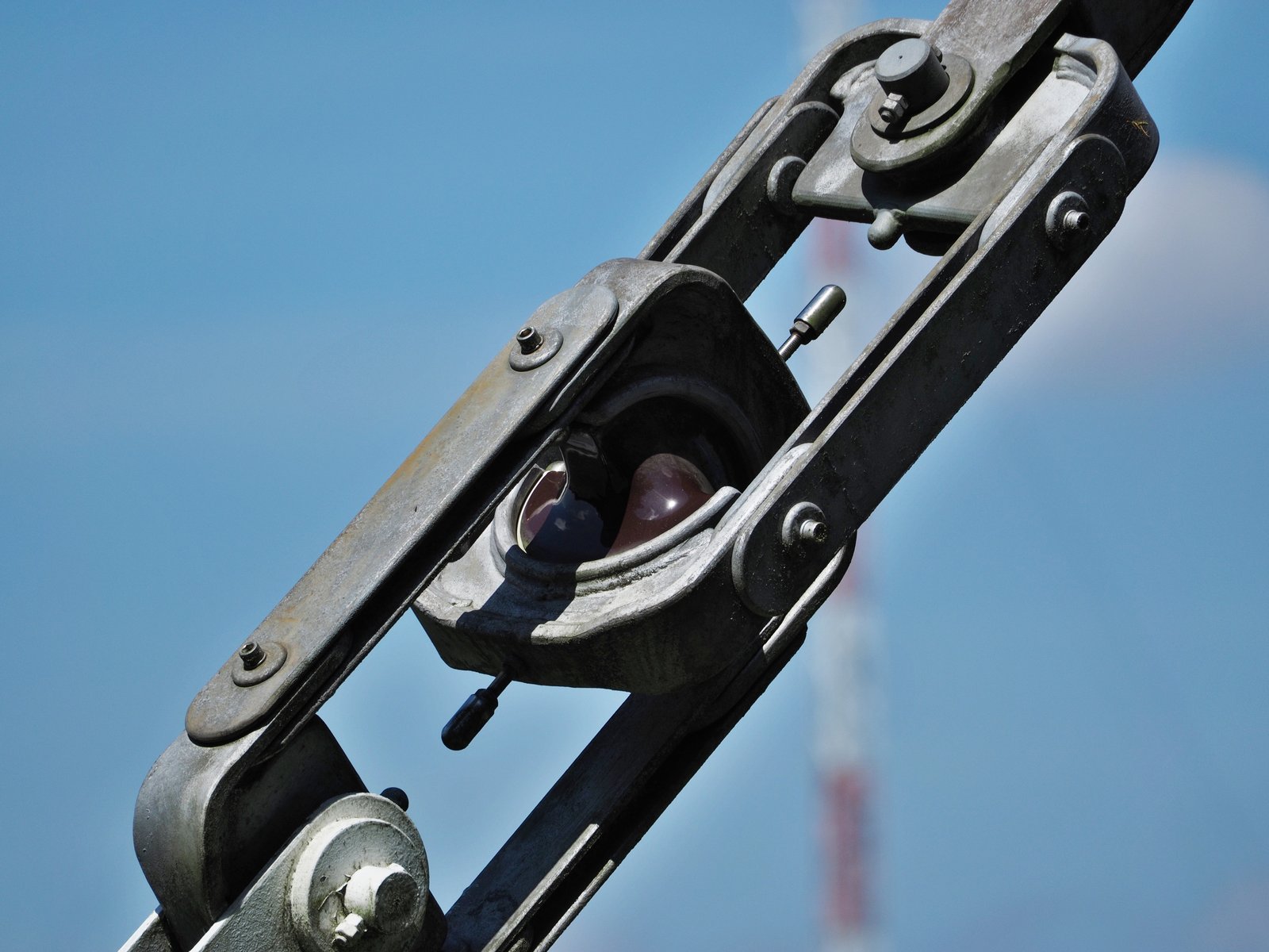 Porcelain guy strain insulator inside galvanized end fittings on a tower guy wire
