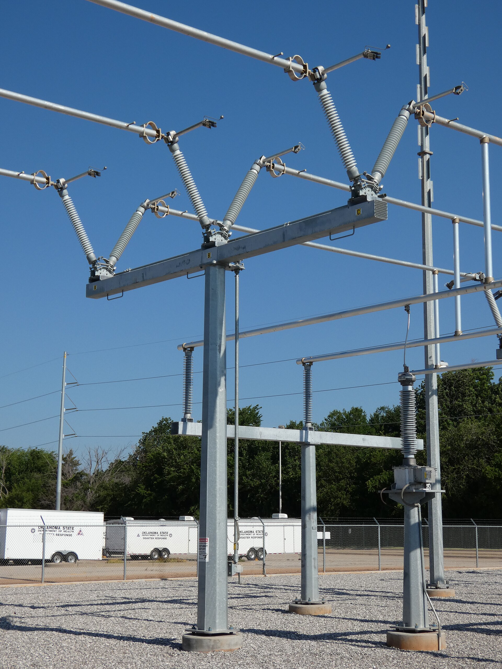 138 kV substation disconnect switch assembly supported on grey post insulators